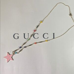 Unique Upcycled Gucci charm on a gold and colored bead chain